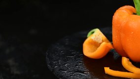 Fresh orange Paprikas (4K, rotating,  not seamless loopable)