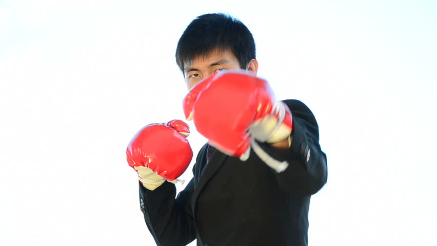 businessman and hand boxing glove ready to fight