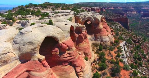 Red And White Striped & Banded Sandstone Arches In Desert Landscape - Rattlesnake Arches In Colorado, USA