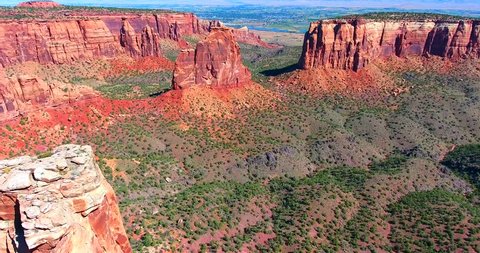 Dramatic Red Buttes In Desert Valley - Colorado National Monument