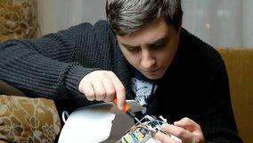 The technician hold the screwdriver for repairing the computer. the concept of computer hardware, repairing, upgrade and technology. - Powered by Shutterstock - Get 15% off with code: PIKWIZARD15