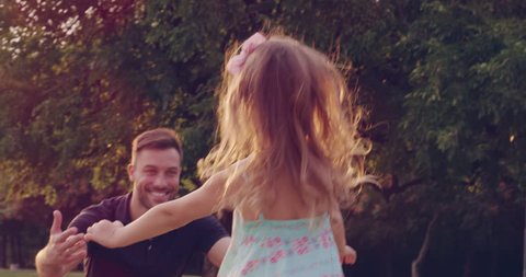 Father Embracing His Little Girl Running Toward Him In The Park At Sunset Family Happiness Beautiful Life Concept Slow Motion Shot On Red Epic 8K