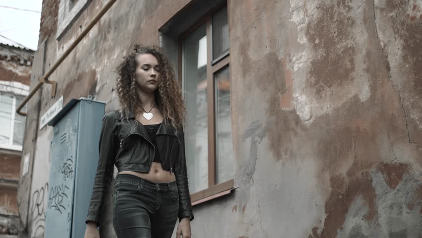 Hipster girl walking on sunset, sad student girl woman have problems