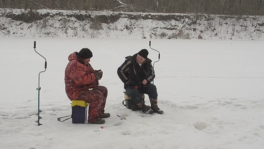 fishermen on ice catching fish, winter fishing