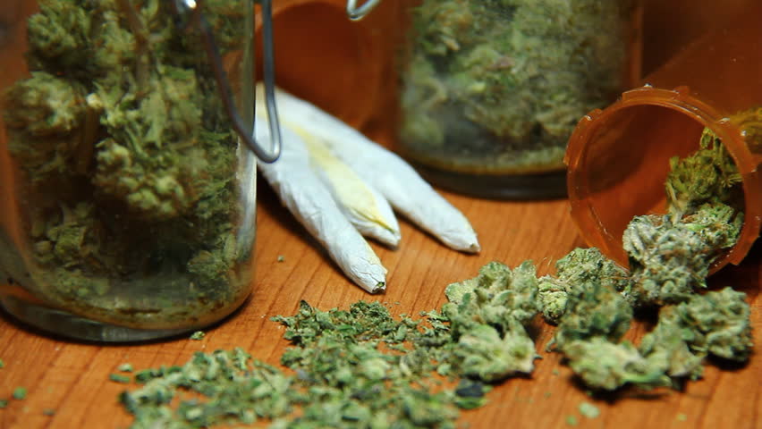 Cannabis and Smoke 3. Nuggets of marijuana, glass jars, prescription bottles and