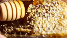 4k, slow motion. someone opens the beeswax with a honeycomb spoon. blur. background