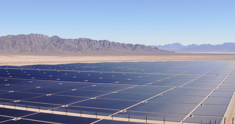 Aerial view flying over large industrial solar energy farm in desert | Shutterstock HD Video #32290711