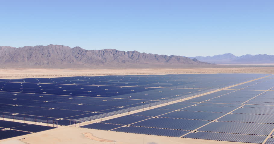 Aerial view flying over large industrial solar energy farm in desert | Shutterstock HD Video #32290714