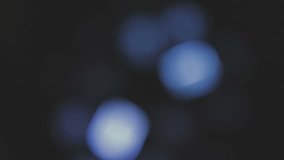 Blurred, bokeh lights background. Abstract sparkles. Full HD loop, 1080p