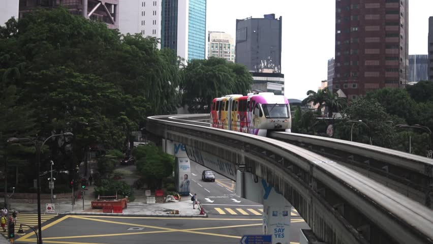 Monorail trains going in opposite directions on a bend in downtown Kuala Lumpur. Malaysia's capital city. | Shutterstock HD Video #32299243