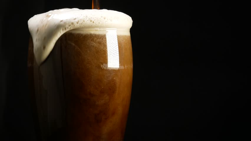 Foaming big stout, porter or dark beer | Shutterstock HD Video #32300095