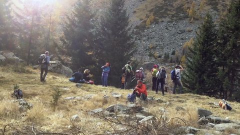 CHIRONICO, SWITZERLAND - OCTOBER 29,2017: Hikers at a time of pause after a mountain climb.