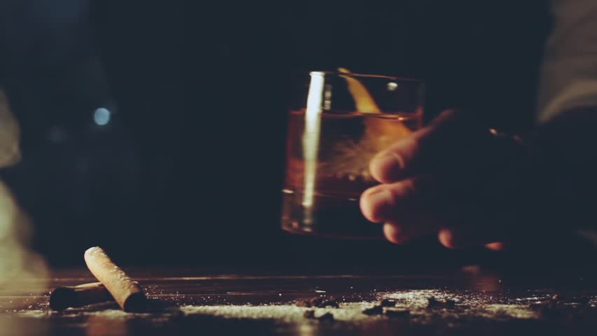 Alcohol cocktail with ice cubes on bar | Shutterstock HD Video #32310814