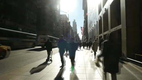 NEW YORK - CIRCA January, 2013: Crowd of People walking on street sidewalk