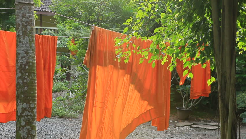 thai buddhist monk clothes hanging on rope line