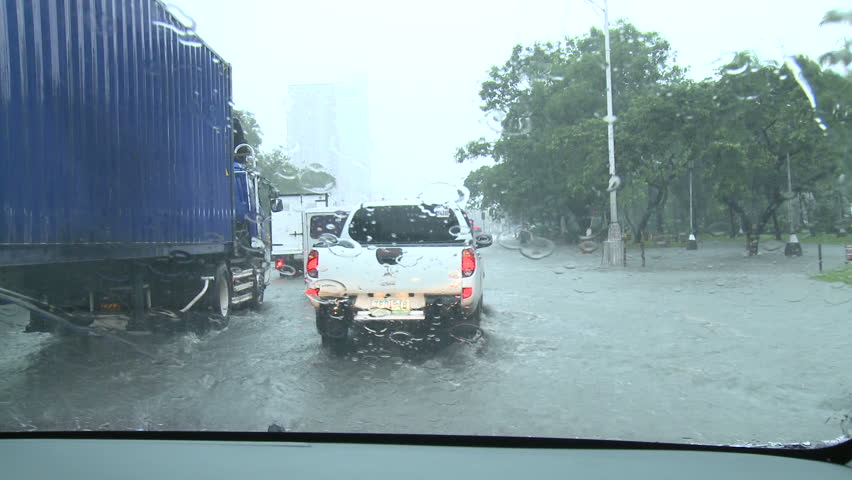 MANILA, PHILIPPINES - CIRCA AUGUST 2012: Driving In Flooded Road Tropical Storm.