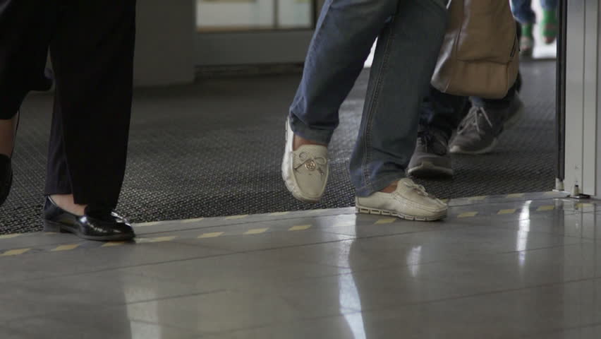 Business center. People walking. Managers and workers. Legs. Slow motion. Saint Peter-burg, Russia.