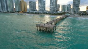 Aerial pull out fishing pier Sunny Isles Beach FL 4k 60p