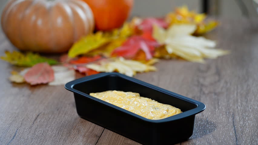 A woman in the kitchen to cook pumpkin bread
