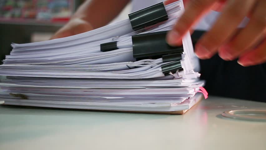 Businessman searching documents files or information in Stack of papers folder on work in office, Business report paper or piles of unfinished document achieves with clips on offices, Business concept Royalty-Free Stock Footage #32338408