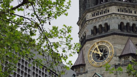 May, 2017 Berlin, Germany. Kaiser Wilhelm Memorial Church upward angle close up of bell tower clock during the day.