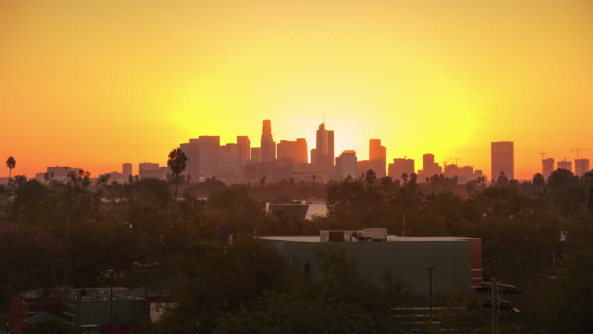 Sunrise over city, closeup on modern downtown Los Angeles skyline buildings silhouettes. 4K UHD timelapse. Royalty-Free Stock Footage #32355847