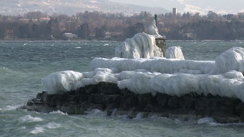 Extreme Ice Storm Hits Lake Shore. Thick ice coats the shore of Lake Geneva after record breaking cold weather hits Europe in February 2012. Shot in Full HD 1920x1080 30 on Sony EX1