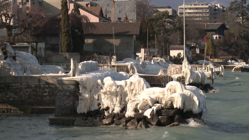 Extreme Ice Storm Hits Lake Shore. Thick ice coats the shore of Lake Geneva