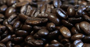 Roasted brown coffee beans, can be used as a background. 4k video.