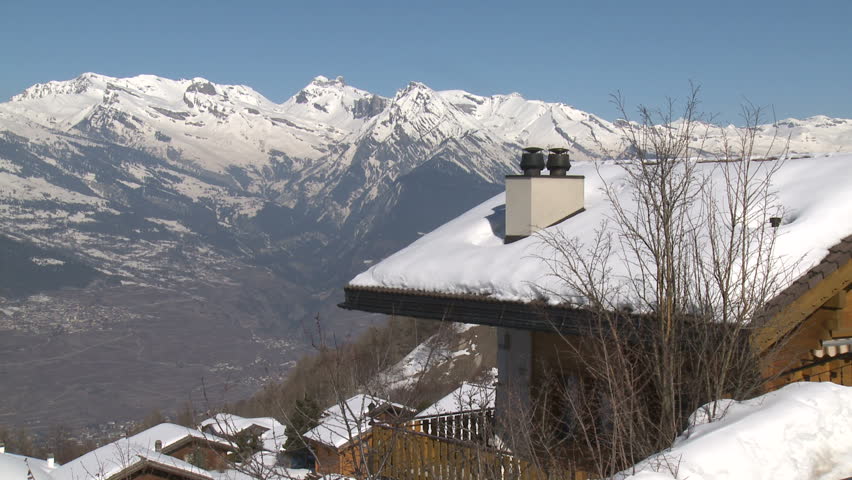 Chalets In Stunning Mountain Scenery. Snow covered chalets high in the beautiful