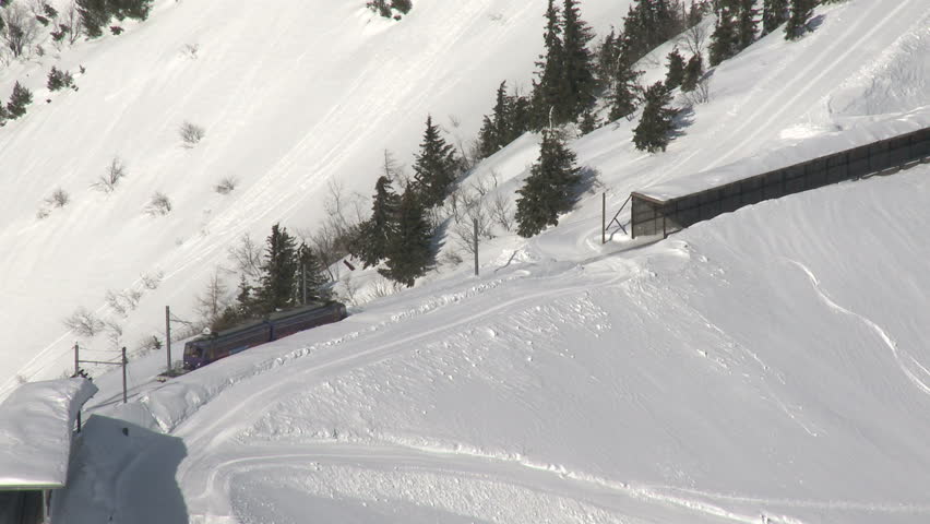 Alpine Train In Winter Landscape. The Montreux to Roche de Naye train in