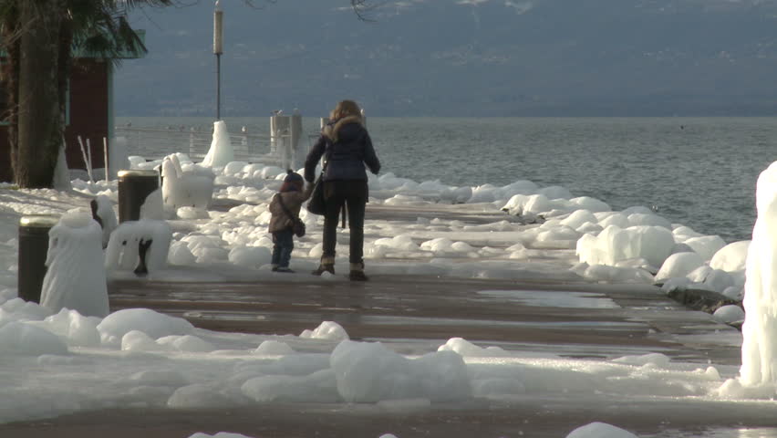 Ice Storm Effects In Lake Geneva. Thick ice coats the shore of Lake Geneva after