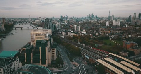 Aerial drone flight over Clapham Junction Station in London, England.  Good Cityscape for an establish shot, or clip about public transit.