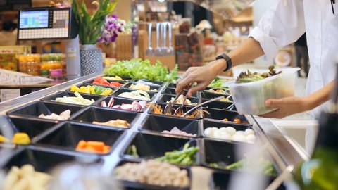 Salad Bar in Shopping Mall. Young Woman Buying Organic Vegetables for Salad. Vegetarian Take Away Food Fitness Diet Healthy Lifestyle Concept. 4K.