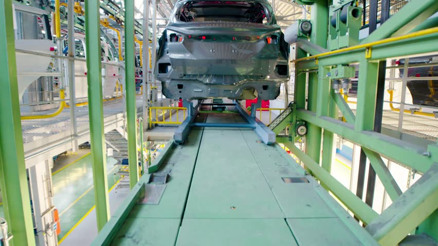 Mass production in car manufacturing industry. Car lifts for assembly line Royalty-Free Stock Footage #32377066