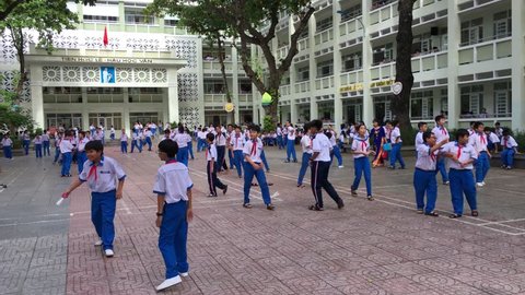 VUNG TAU, VIETNAM - SEPTEMBER 2017: Unidentified schoolchildren play in the yard of the Vung Tau Secondary School during a break. 