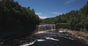 4k Video flying backwards above Tahquamenon falls in northern Michigan 4