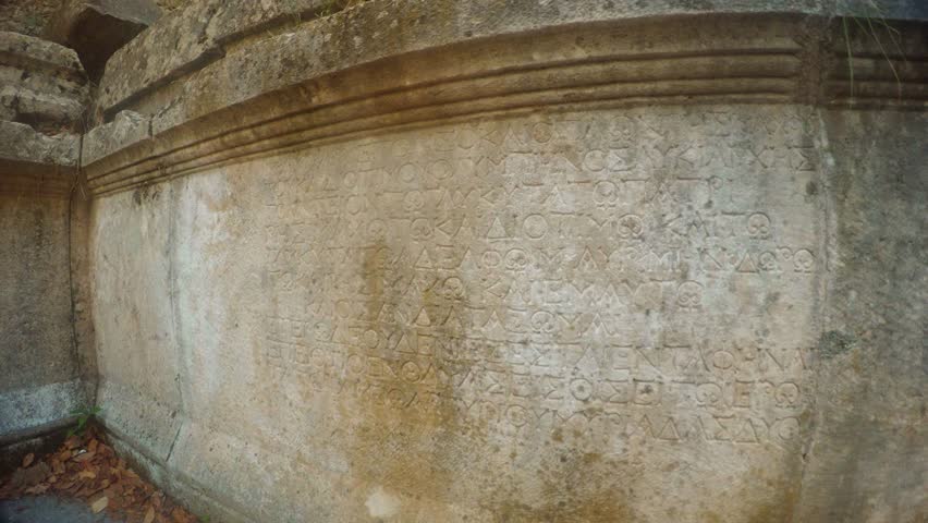 wall with ancient Greek or pre-Christian inscriptions, possibly a sarcophagus, burial, two thousand-year-old city of Olympos, Lycia, Lycian trail