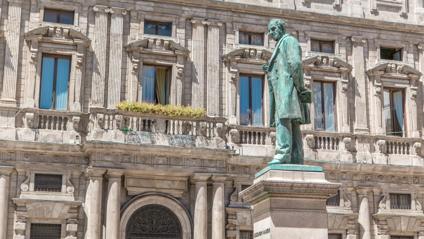 Alessandro Manzoni Statue timelapse, important Italian writer and poet of the nineteenth century, Milan city center, Italy. Sunny summer day
