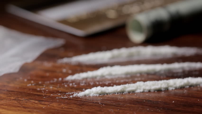 Pan right to lines of cocaine
