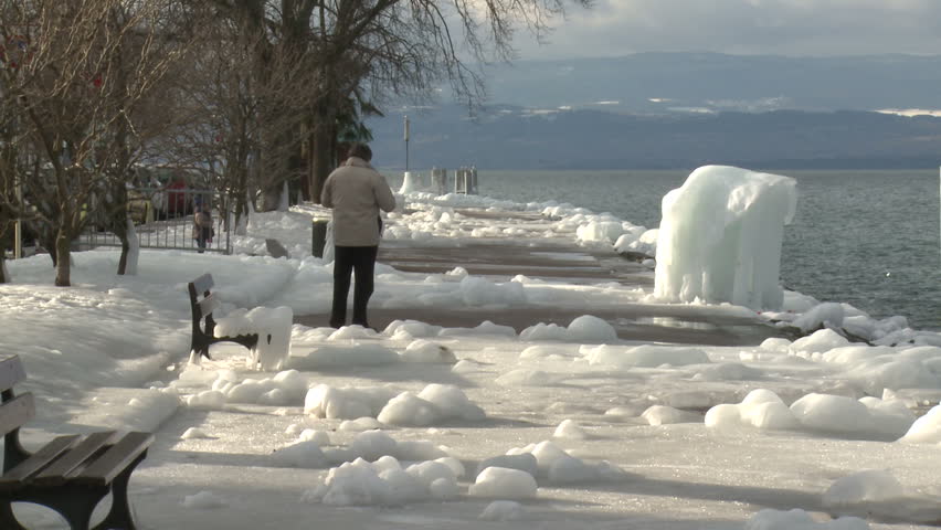 Ice Storm Effects In Lake Geneva. Thick ice coats the shore of Lake Geneva after