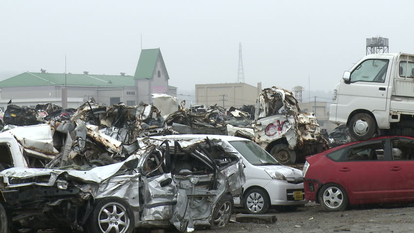 KESENNUMA, JAPAN - CIRCA  2011: Wrecked Cars. Stacks of wrecked and destroyed