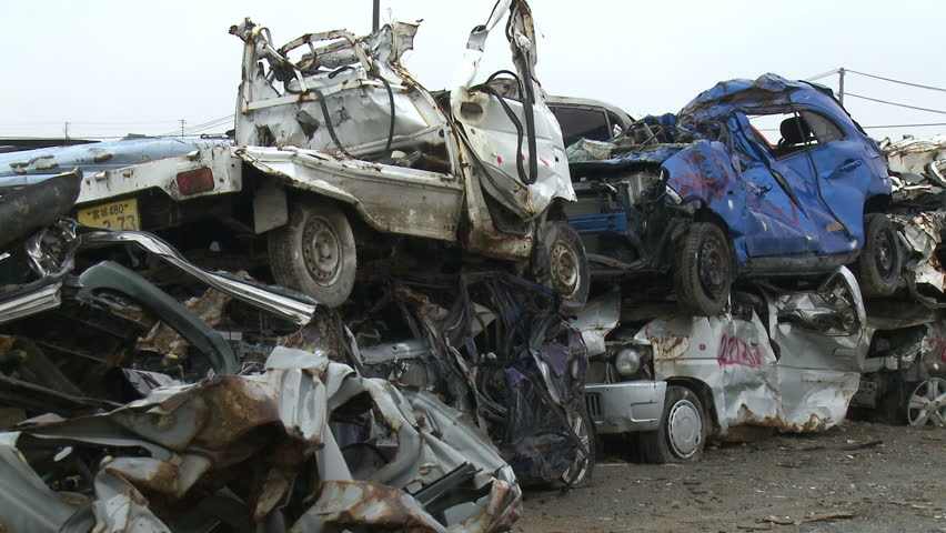 KESENNUMA, JAPAN - CIRCA  2011: Wrecked Cars. Stacks of wrecked and destroyed