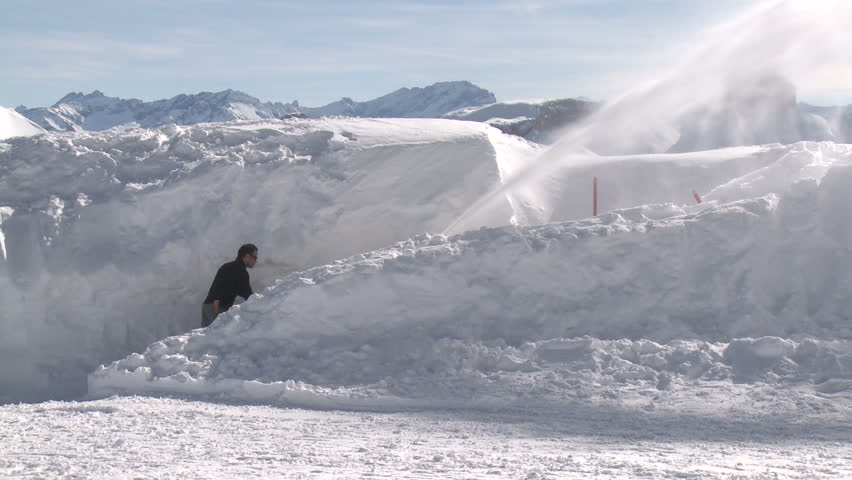Snow Blower Clears Snow From Mountain Summit. Filmed in full HD 1920x1080 30p on