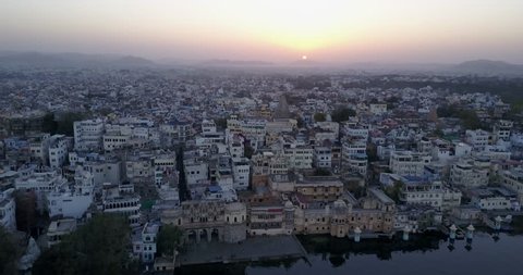 Aerial Sunset over Lake Pichola and the City Palace in Udaipur, Rajasthan, India - 4K