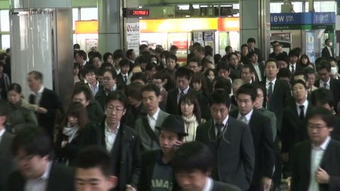 TOKYO, JAPAN - 6 NOVEMBER 2012: Commuters going to work make their way through the busy Shinagawa train station during rush hour in Tokyo, Japan