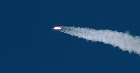 ICBM missile rocket flying into space with exhaust flames and smoke in 4K.