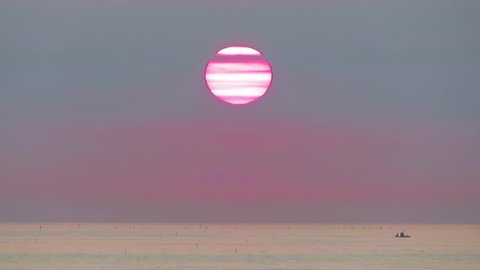 Morning on the beach - Time lapse of Sunrise from sea.