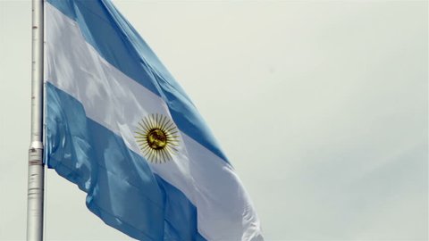 Argentina Flag waving at Plaza de Mayo, Buenos Aires, Argentina.