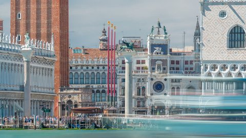 View of the Campanile di San Marco (St Mark's belfry) and Palazzo Ducale (Doge's Palace), from San Giorgio Maggiore timelapse, Venice, Italy. Blue cloudy sky at summer day